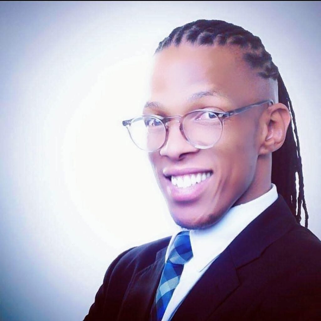 Tholulwazi wearing glasses and smiling