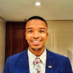 Man in a suit smiling