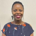 A black woman, Zinhle Dlomo, smiling