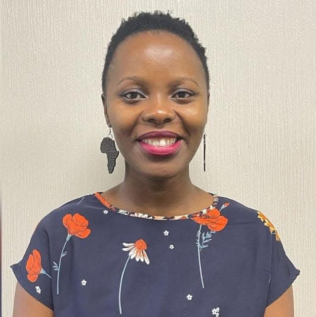 A black woman, Zinhle Dlomo, smiling